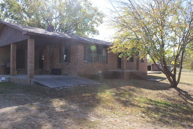 back of house with a patio