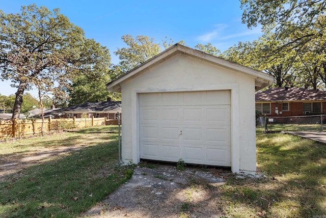 garage featuring a yard