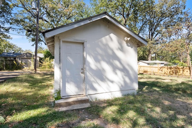 view of outbuilding featuring a yard