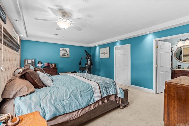 bedroom featuring ceiling fan, sink, and light carpet