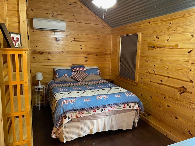 bedroom featuring an AC wall unit, lofted ceiling, hardwood / wood-style floors, and wood walls