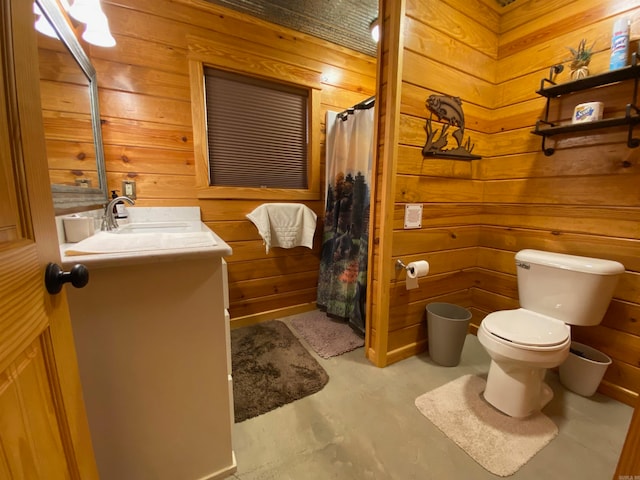 bathroom featuring vanity, a shower with shower curtain, toilet, and wood walls