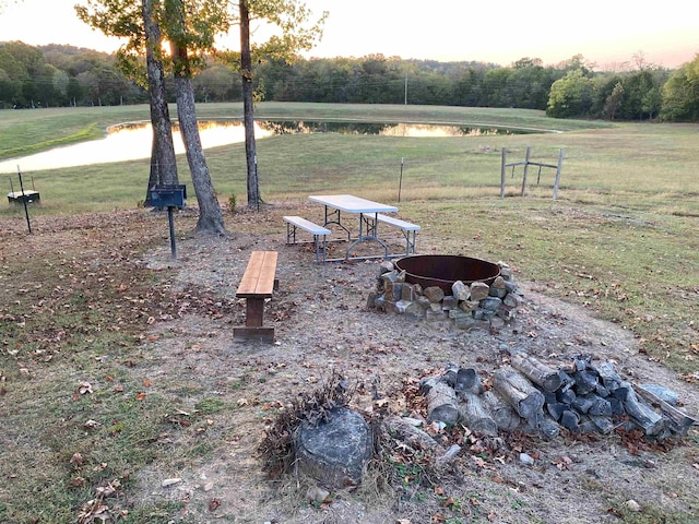 yard at dusk with a water view