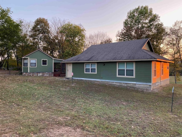 view of front of property with a lawn