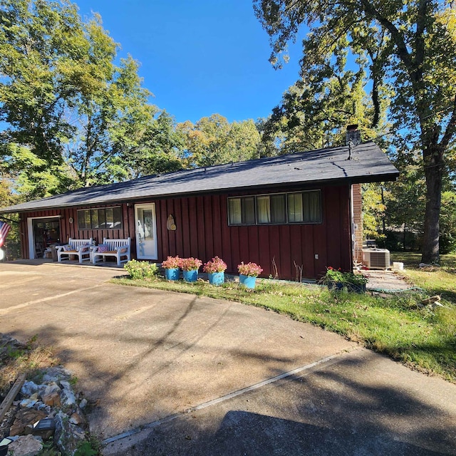 view of front of property featuring central air condition unit and a porch