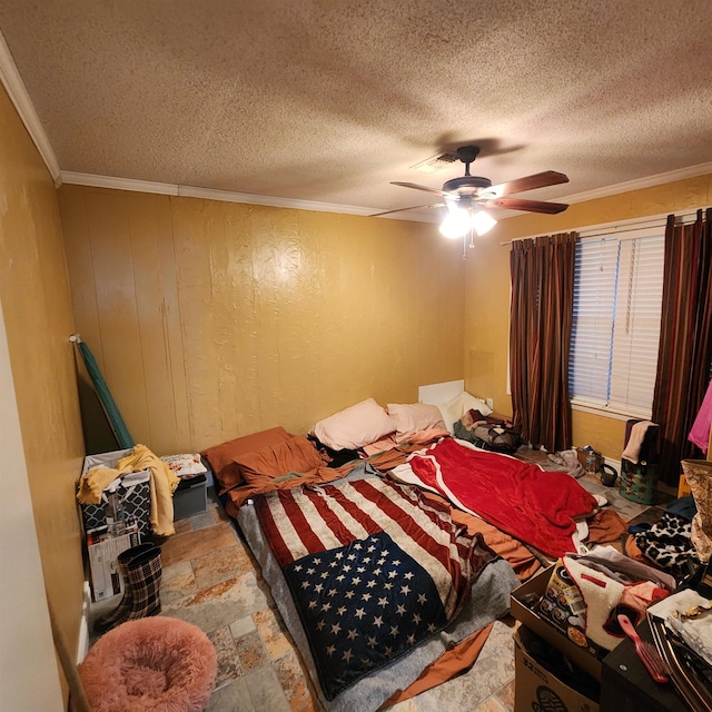 bedroom featuring a textured ceiling, ornamental molding, and ceiling fan