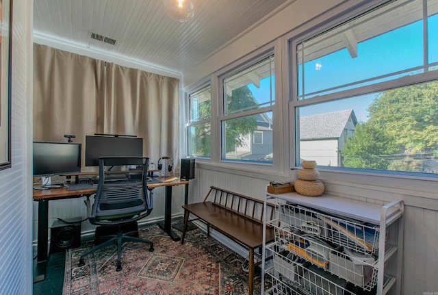 office space with wood walls