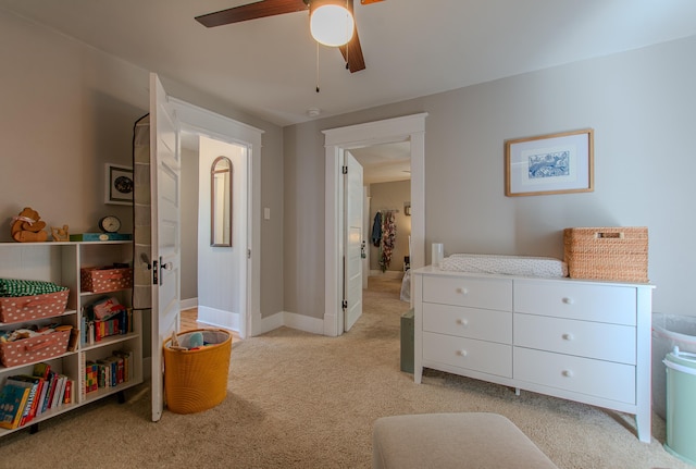 bedroom featuring ceiling fan and light carpet