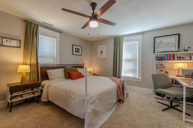 bedroom with light colored carpet and ceiling fan