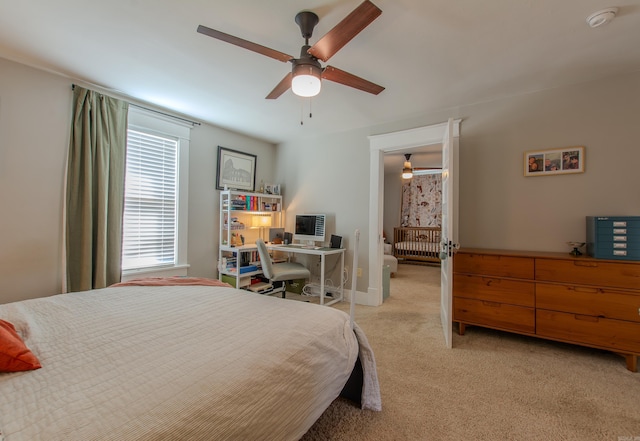 bedroom featuring light carpet and ceiling fan