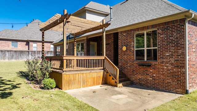 back of property featuring a pergola, a patio, and a yard