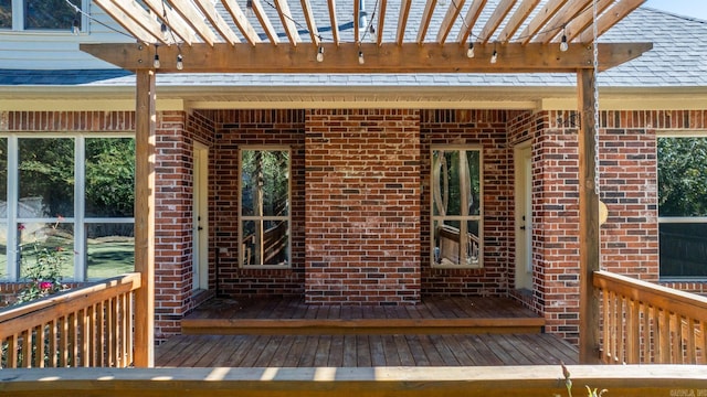 wooden deck featuring a pergola