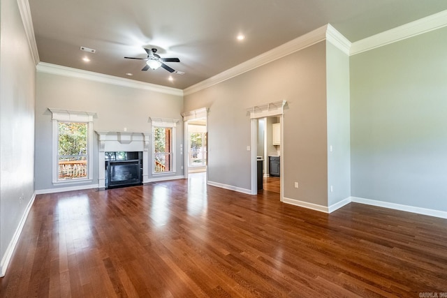 unfurnished living room featuring ceiling fan, ornamental molding, and dark hardwood / wood-style flooring