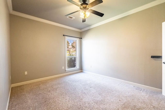 carpeted empty room with ceiling fan and ornamental molding