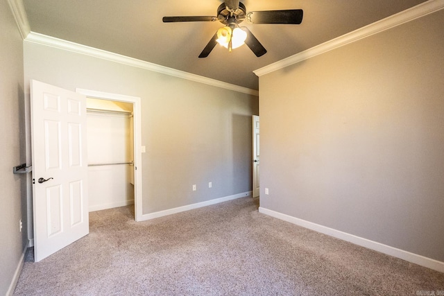 unfurnished bedroom featuring light carpet, crown molding, and ceiling fan