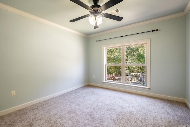 carpeted empty room featuring crown molding and ceiling fan