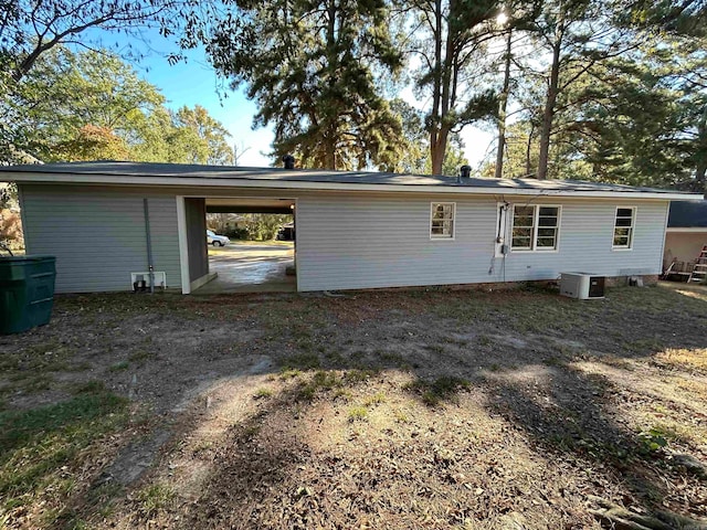 back of house featuring cooling unit