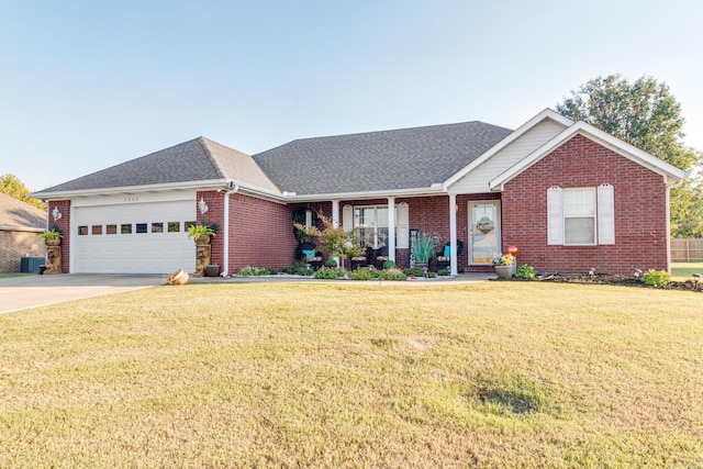 ranch-style home featuring a front lawn and a garage