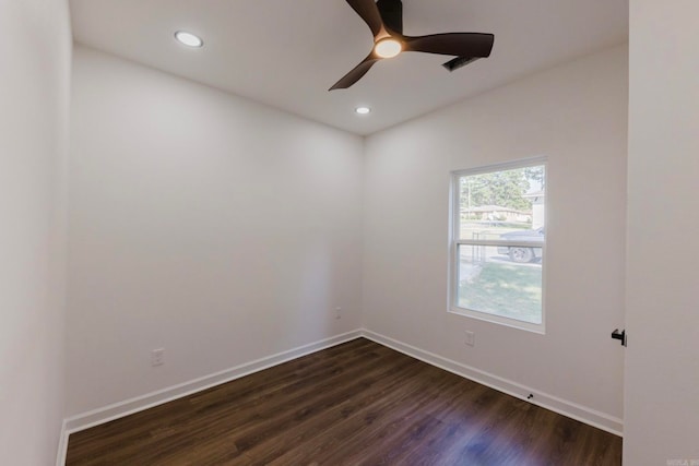 empty room with dark hardwood / wood-style floors and ceiling fan