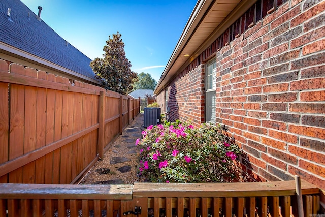 view of side of home featuring cooling unit