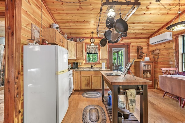 kitchen with a wall mounted air conditioner, wood ceiling, vaulted ceiling, light hardwood / wood-style flooring, and white refrigerator