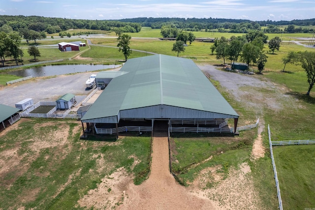 birds eye view of property with a water view and a rural view