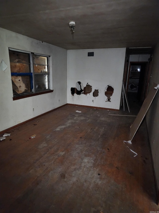 empty room featuring dark hardwood / wood-style flooring