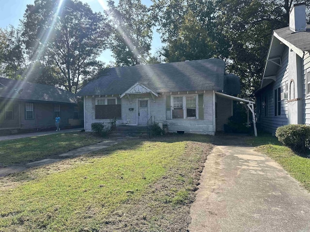 1706 S Laurel, Pine Bluff, AR 71603 - bungalow featuring brick siding, driveway, and a front lawn