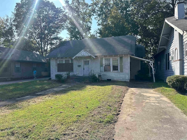 bungalow with a front yard