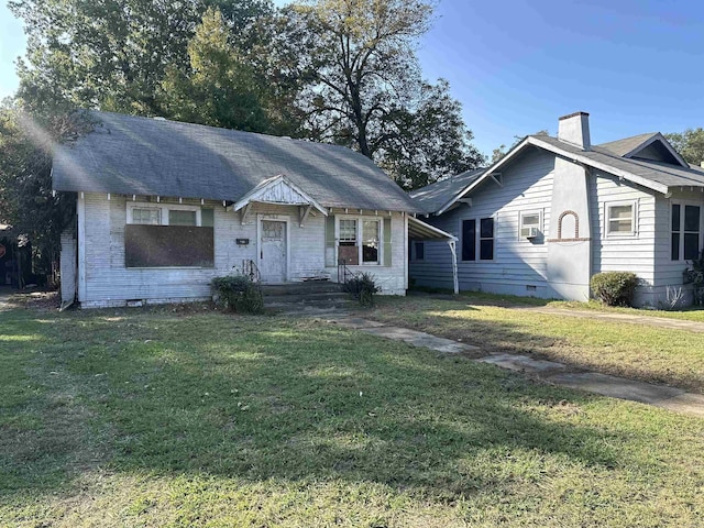 1706 S Laurel, Pine Bluff, AR 71603 - bungalow with a chimney, brick siding, and a front yard
