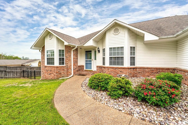 ranch-style home with a front yard