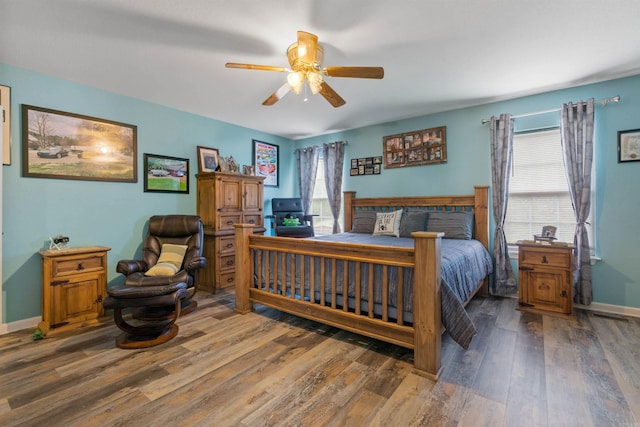 bedroom featuring dark hardwood / wood-style floors and ceiling fan