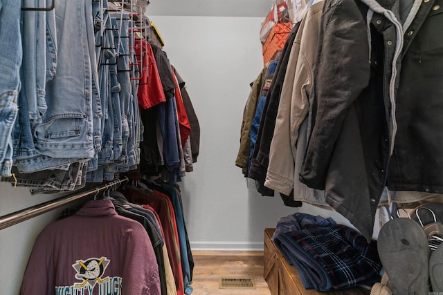 spacious closet with light hardwood / wood-style floors