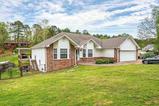 ranch-style house featuring a front lawn and a garage