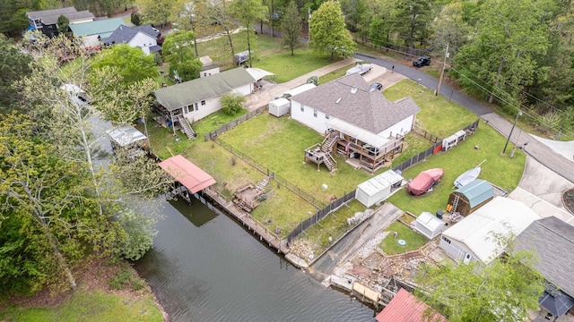 birds eye view of property featuring a water view