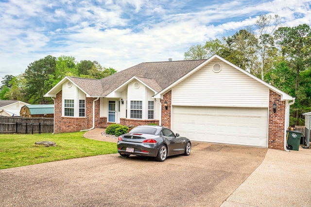 ranch-style home with a front yard and a garage