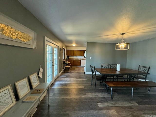 1211 S Edgewater Rd, Horseshoe Bend, AR 72512 - dining space featuring dark wood-style floors, a chandelier, and french doors