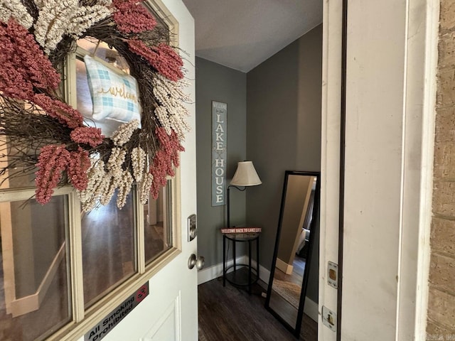 1211 S Edgewater Rd, Horseshoe Bend, AR 72512 - hall featuring dark wood-style flooring and baseboards