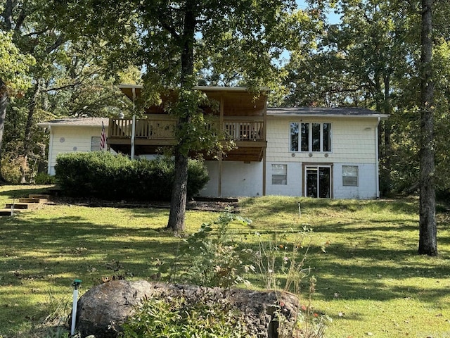 rear view of house with a yard