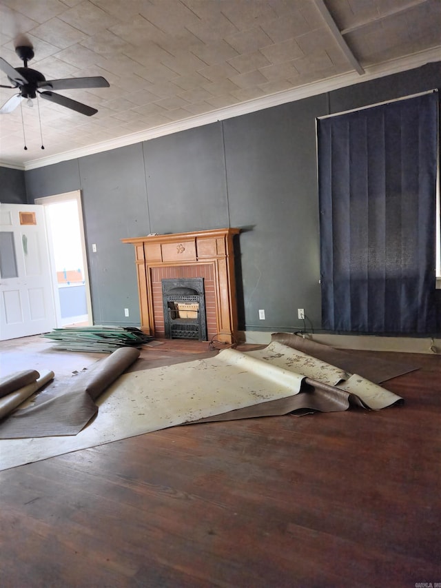 unfurnished living room with ceiling fan, wood-type flooring, and ornamental molding