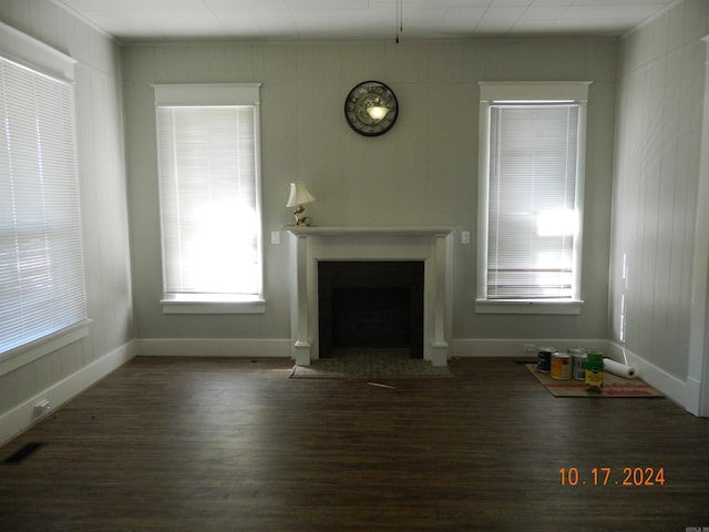 unfurnished living room featuring dark hardwood / wood-style floors