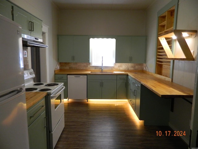 kitchen featuring wood counters, dark hardwood / wood-style floors, sink, green cabinetry, and white appliances