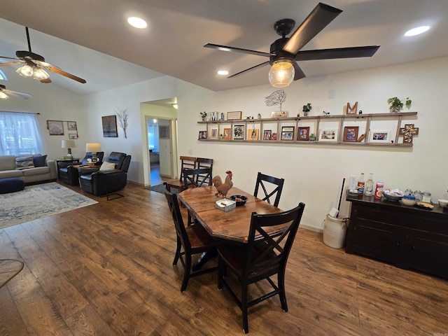 dining area with lofted ceiling, dark hardwood / wood-style floors, and ceiling fan