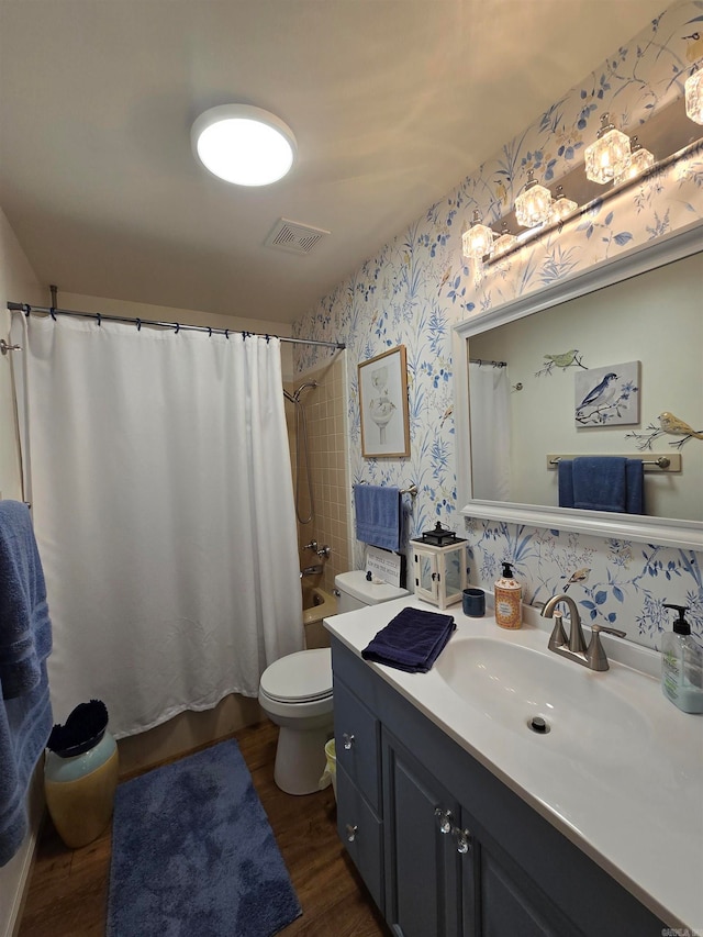 full bathroom with shower / bath combination with curtain, toilet, hardwood / wood-style flooring, and vanity