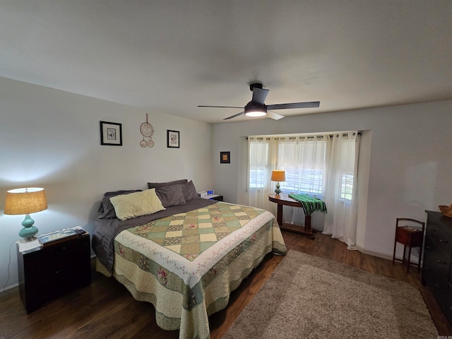 bedroom featuring dark hardwood / wood-style floors and ceiling fan