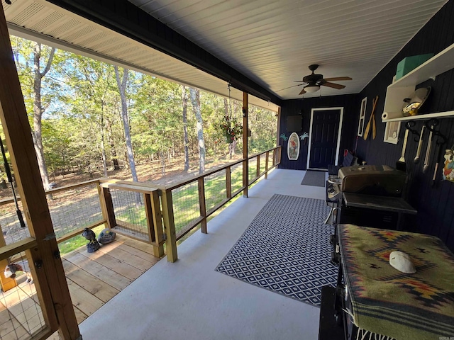 sunroom featuring a wealth of natural light and ceiling fan