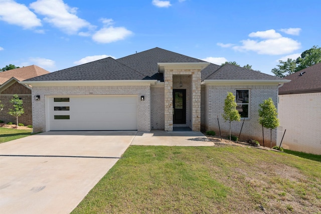 view of front facade with a front lawn and a garage