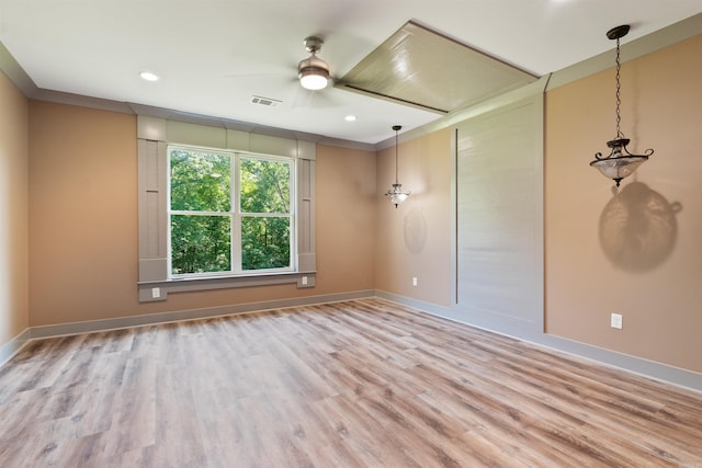 empty room featuring light wood-type flooring and ceiling fan