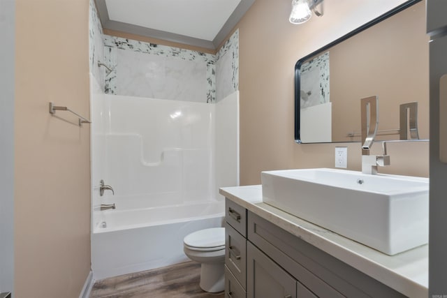 full bathroom featuring vanity, toilet, hardwood / wood-style flooring, and shower / bath combination