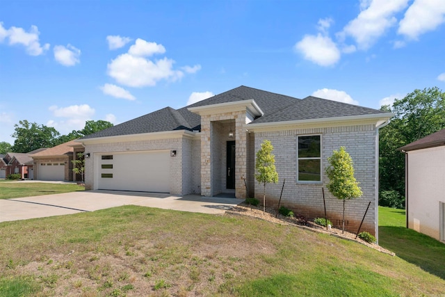 view of front of property with a front lawn and a garage